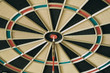 © Sergio - Closeup of dart board with dart in the bulls eyes.