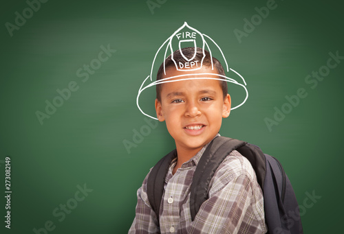 Young Hispanic Student Boy Wearing Backpack Front Of Blackboard with Fireman ...