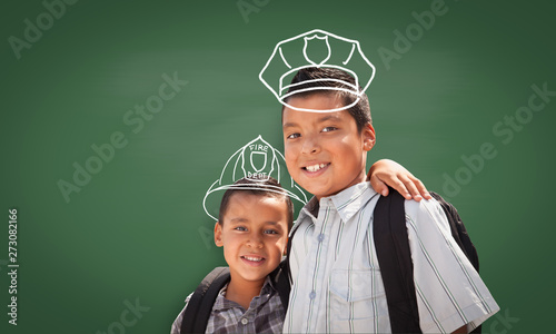 Young Hispanic Student Boy Wearing Backpack Front Of Blackboard with Fireman ...