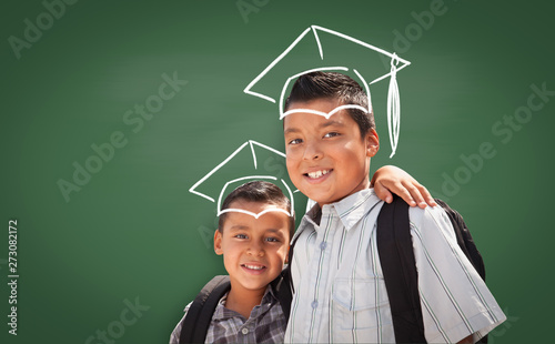 Young Hispanic Student Boys Wearing Backpack Front Of Blackboard with Fireman...