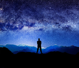 silhouetted man and lights of universe
