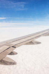 Wall Mural - plane wings and the sky view from the passenger window