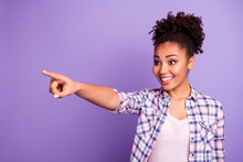 Portrait Of Her She Nice Charming Cute Attractive Lovely Cheerful Cheery Wavy-haired Girl In Checked Shirt Pointing Far Indicate Index Isolated Over Violet Purple Pastel Background