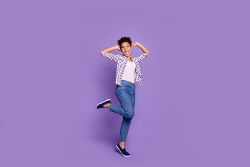 Wall Mural - Full length body size view photo cute careless playful lady student touch head hands palms rejoice enjoy content shout laugh free time checked shirt jeans denim top-knot isolated purple background