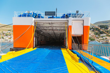 Wall Mural - Big ferry transportation ship waiting for cargo and passengers at the pier