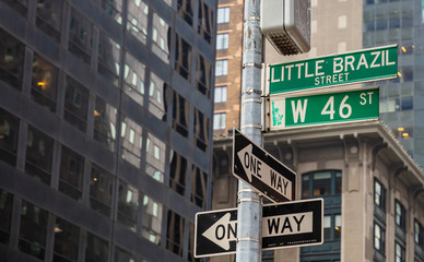 West 46th street sign, Manhattan New York downtown. Blue color street signs