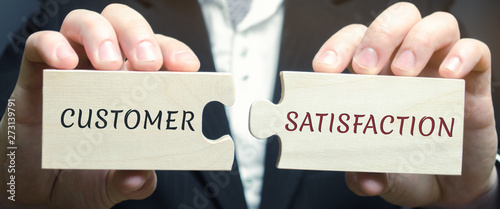 Businessman collects wooden puzzles with the word Customer Satisfaction ( CSat ) Tableau sur Toile