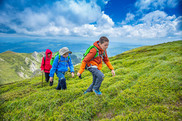 Two kids are hiking