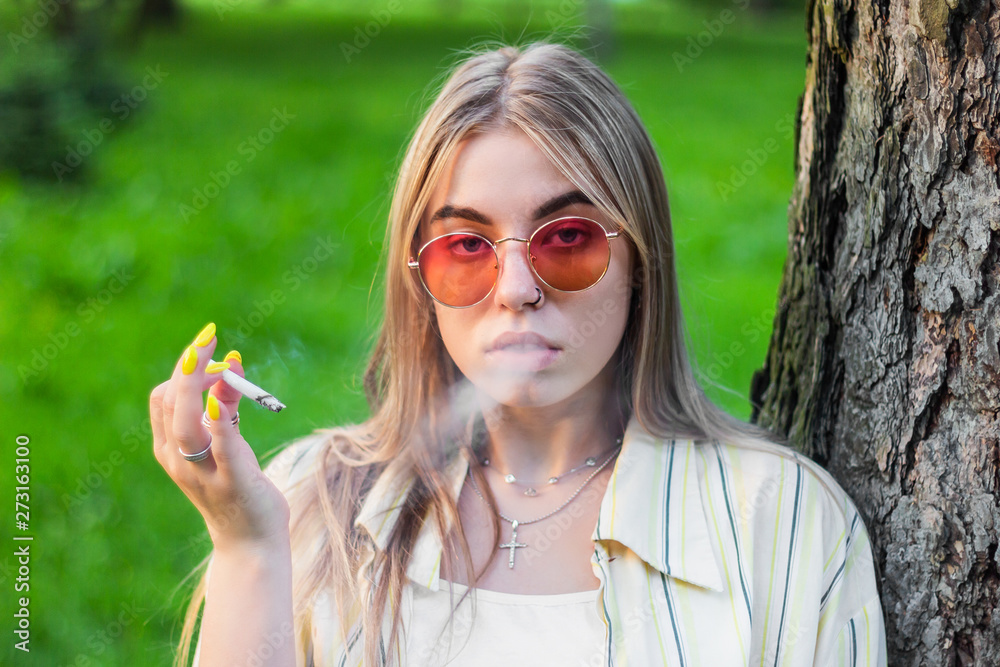 smoking cigarettes makes me tired girl smoking cigarette tired depression Stock Photo