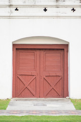 Wall Mural - Old wooden door in Thailand temple