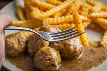 Poster - Meatballs with french fries in dill sauce.