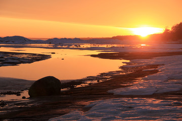  Snow and ice on north sea at sunset