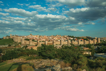 City landscape with large stone wall and towers at Avila