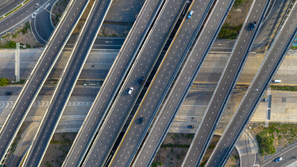 Wall Mural - Aerial top view of highway, Transport city junction road with car on Intersection cross road shot by drone