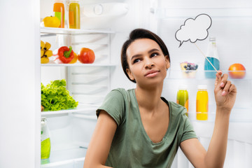 Young smiling lady thinking what food to choose