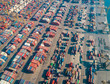 © AmazingAerialAgency - Aerial view of gigantic cargo port full of containers, Dubai, U.A.E.