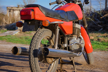 back of a vintage motorcycle, red bike