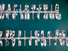 Aerial View Of Boats Moored At Harbor
