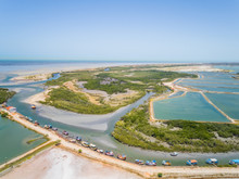 Aerial View Of Fishing Boat Group Anchored Near Big Salt Industry, Brazil.