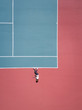 Aerial concept of a person on a tennis court.