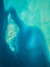 Aerial View Of The Turquoise Sea In Bora-Bora, French Polynesia.