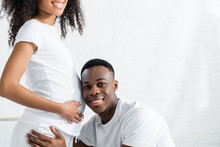 Cropped View Of African American Man Listening Tummy Pregnant Wife