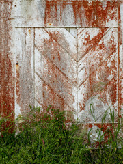 Wall Mural - Old door texture and background predominant colors are red and white