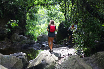 young woman hiking in mountains