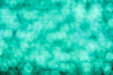 Wall Mural - Background and wallpaper lights blue abstract with blurred and bokeh of LED light bubs reflection on black background.