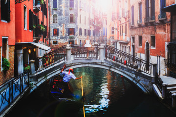 Wall Mural - Ballerina. Young graceful girl ballet dancer, dressed in tutu and point shoes dancing on the bridge in Venice. Beauty of classic ballet  in Venice.