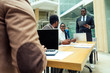 © yurakrasil - well-dressed business indian men making a report to subordinate employees in a modern office