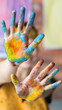 © golubovy - Contemporary art performance. Closeup of female hands dirty with colorful paint. Blur background.
