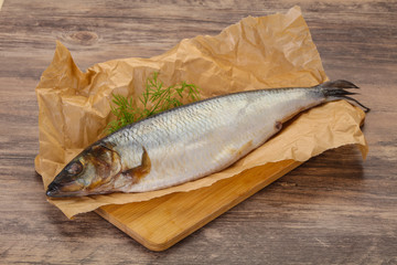 Salted herring over the wooden board