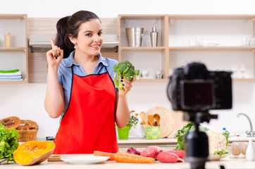 Young female vegetarian recording video for her blog