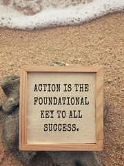 Wall Mural - Motivational and inspirational wording - Action Is The Foundational Key To All Succes. Vintage styled background.