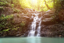 Beautiful Small Waterfall In The Wild With Sun Light,nature