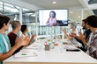 © WavebreakMediaMicro - Business people attending video conference at conference room in a modern office
