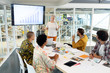 © WavebreakMediaMicro - Businesswoman giving presentation on screen during meeting in a modern office