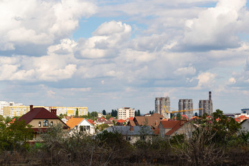 Wall Mural - Outskirts of Chisinau. Panorama with the capital of Moldova. Cloudy sky before the rain.