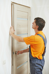 Wall Mural - carpenter at door installation