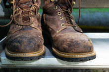 A Pair Of Well Used  Leather Work Boots.