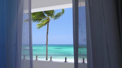 Wall Mural - View from balcony resort on caribbean seashore with coconut palm tree and turquoise sea. Travel destinations. Summer vacation