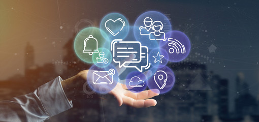 Businessman holding a cloud of social media network icon