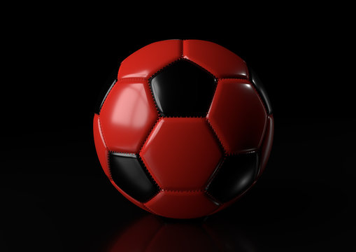 Classic red black soccer ball isolated on black background. 3d render illustration