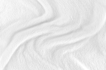 Wall Mural - White fabric texture background with soft waves. selective focus