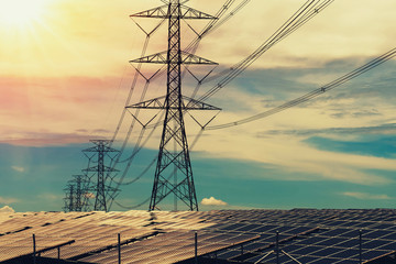 Wall Mural - solar panels with electricity pylon and sunset. clean power energy concept.