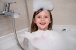 © .shock - little girl in bath playing with foam