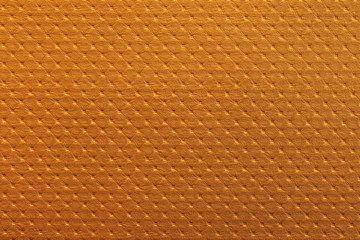 Wall Mural - Orange leather texture background with tile pattern. Detail of luxury sofa surface.