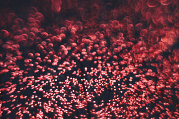 Aufkleber - Beautiful red bokeh on a dark abstract background.