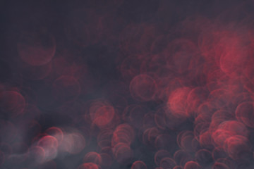 Aufkleber - Beautiful red bokeh on a dark abstract background.